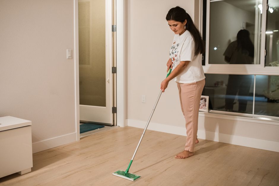 Thoroughly mopping hardwood floor for deep cleaning